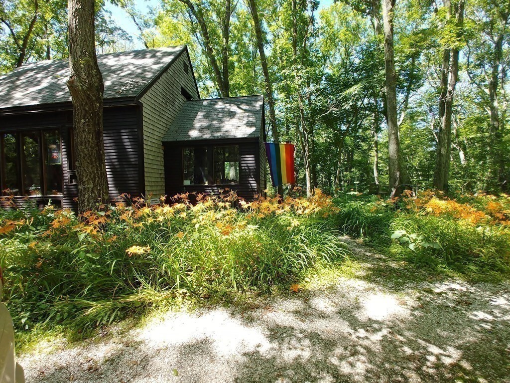 24 Paradise Road Ipswich, MA 01938 - Photo 26 of 27 a front view of a house with a yard