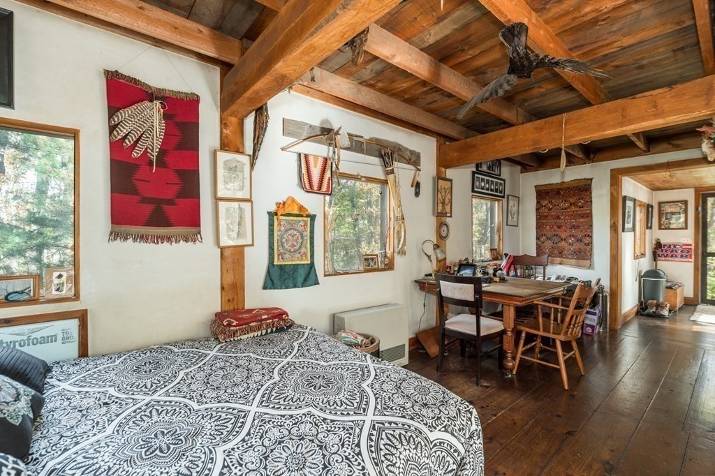 24 Paradise Road Ipswich, MA 01938 - Photo 7 of 27 a bed room with a bed and wooden floor