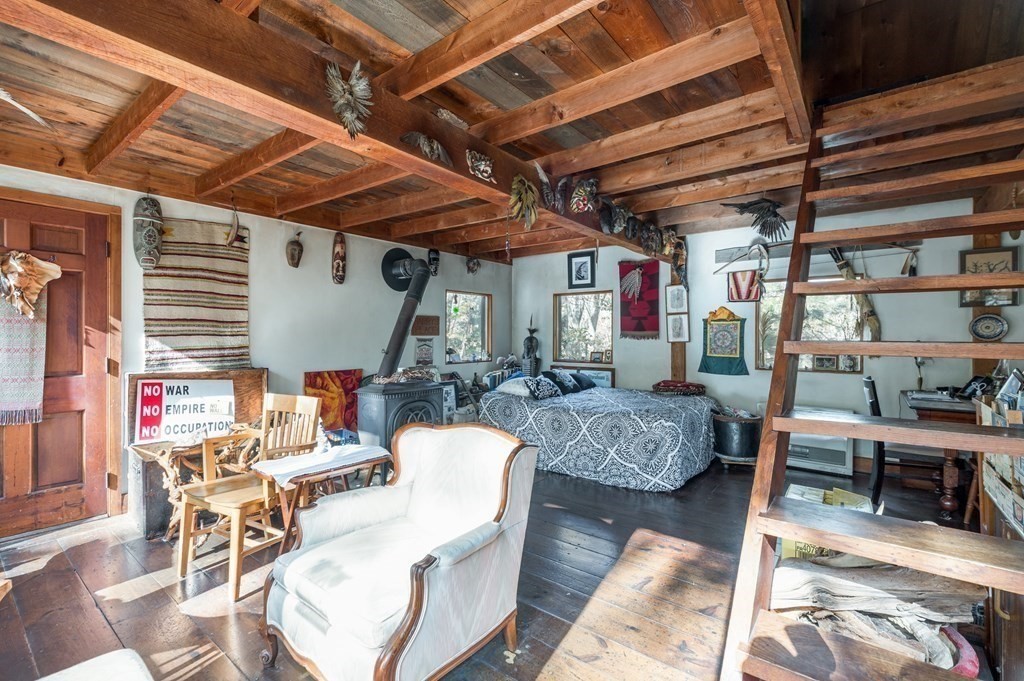 24 Paradise Road Ipswich, MA 01938 - Photo 10 of 27 a living room with furniture and a chandelier