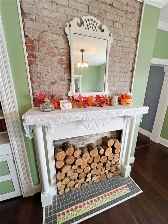 203 Delafayette Street Perryopolis, PA 15473 - Photo 12 of 37 Decorative fireplace and new tile work and exposed brick.