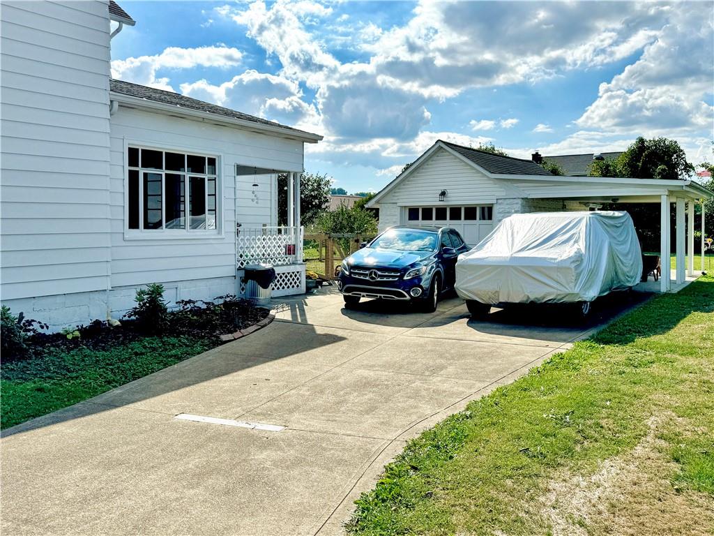 203 Delafayette Street Perryopolis, PA 15473 - Photo 2 of 37 One car detached garage plus carport plus 20x12 shed plus tons of parking!
