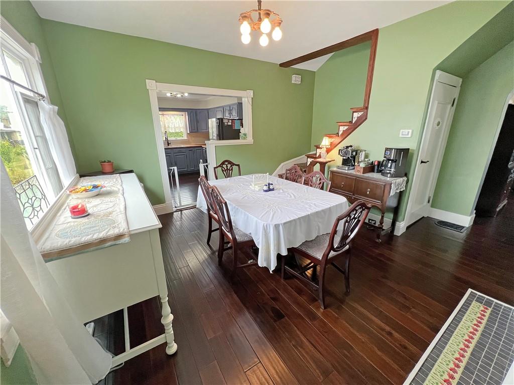 203 Delafayette Street Perryopolis, PA 15473 - Photo 8 of 37 New hardwood flooring flows through into the dining room.