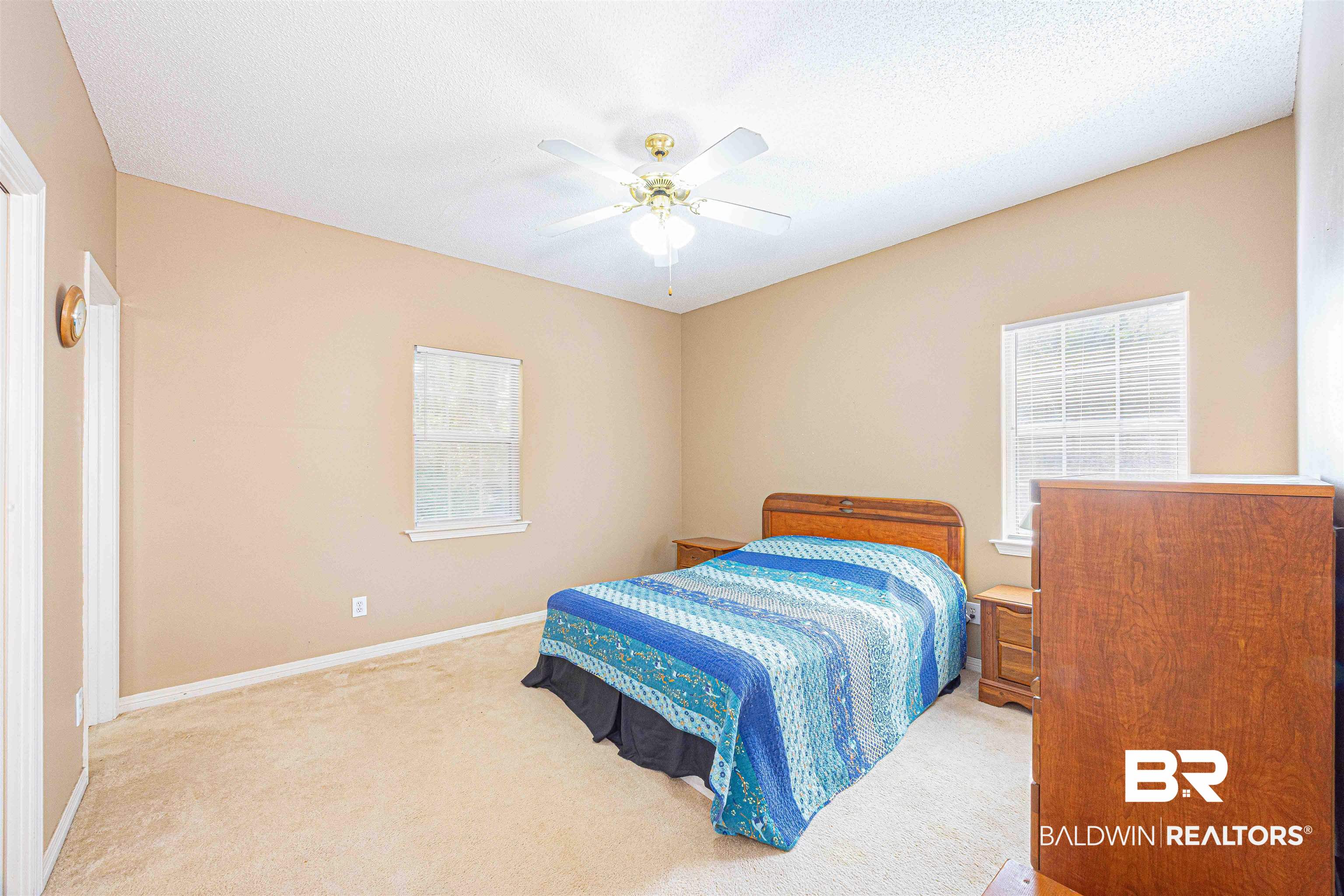 175 Montclair Loop Daphne, AL 36526 - Photo 16 of 44 Carpeted bedroom with ceiling fan and a textured ceiling