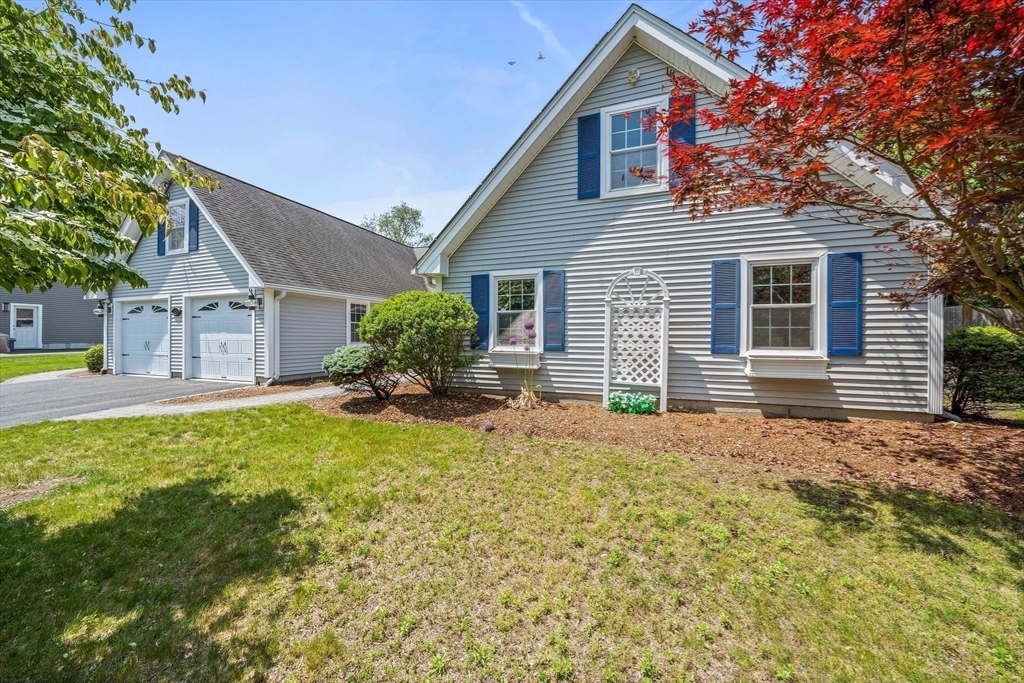 12 Richard Road Natick, MA 01760 - Photo 1 of 42 a front view of a house with garden