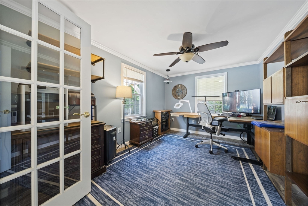 12 Richard Road Natick, MA 01760 - Photo 12 of 42 a living room with furniture a rug and a chandelier