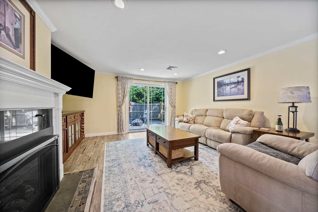 12 Richard Road Natick, MA 01760 - Photo 14 of 42 a living room with furniture and a flat screen tv