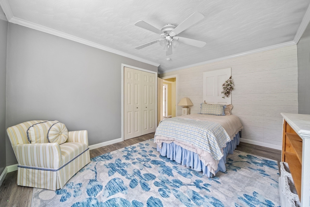 12 Richard Road Natick, MA 01760 - Photo 19 of 42 a bedroom with a bed and chair