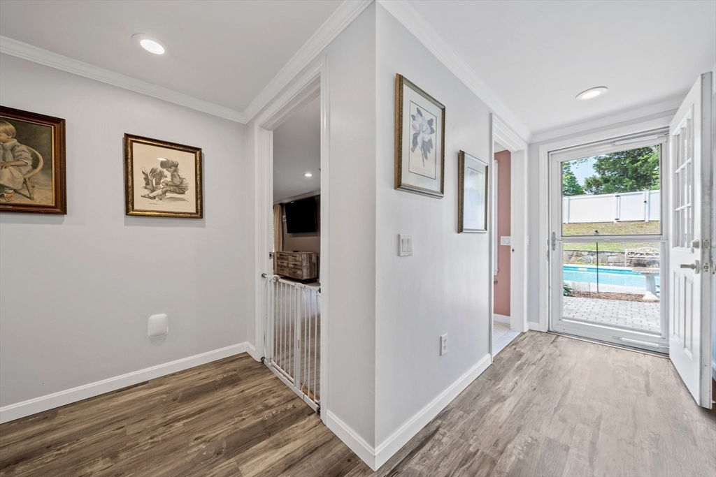 12 Richard Road Natick, MA 01760 - Photo 21 of 42 a view of hallway with wooden floor and door