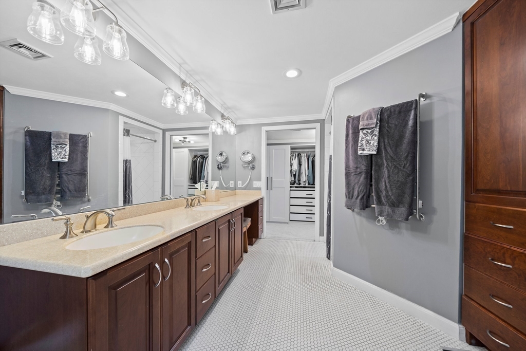 12 Richard Road Natick, MA 01760 - Photo 26 of 42 a spacious bathroom with a double vanity sink a mirror and shower