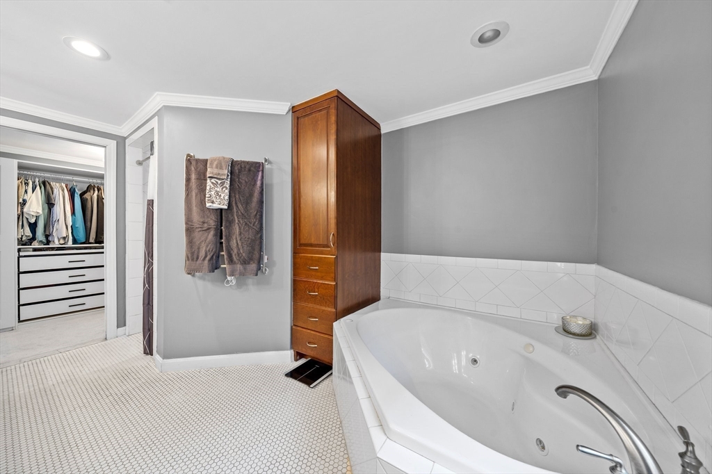 12 Richard Road Natick, MA 01760 - Photo 27 of 42 a bathroom with a tub and shower