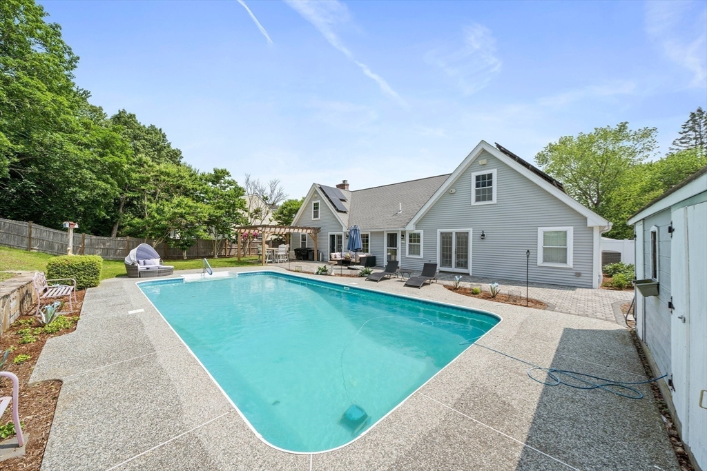 12 Richard Road Natick, MA 01760 - Photo 34 of 42 swimming pool view with a seating space and a small garden
