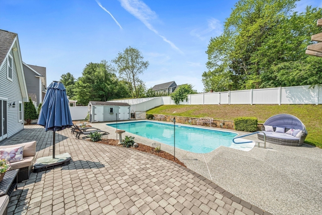 12 Richard Road Natick, MA 01760 - Photo 36 of 42 a view of a swimming pool with a patio