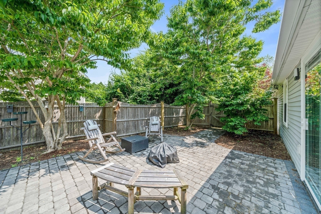 12 Richard Road Natick, MA 01760 - Photo 37 of 42 a view of a table and chairs in the patio