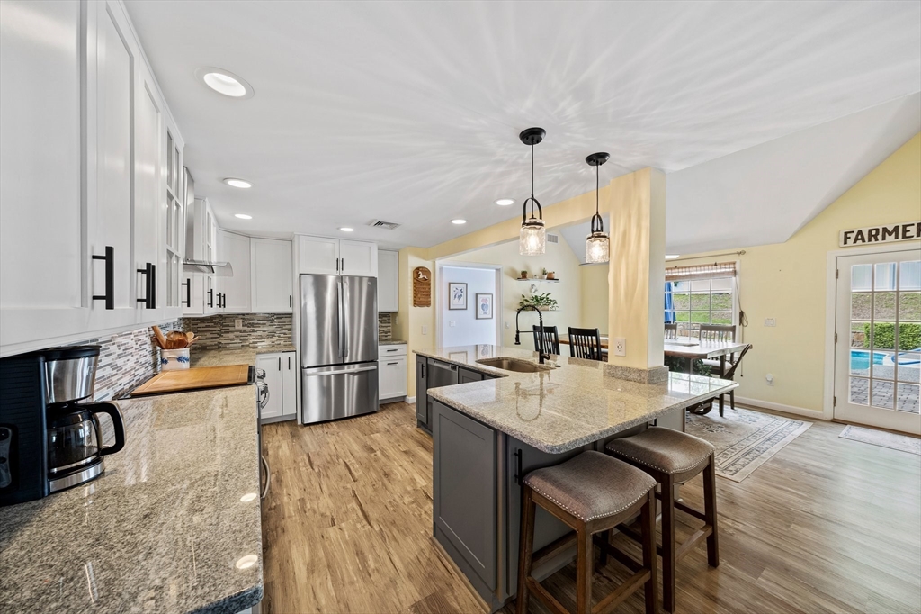 12 Richard Road Natick, MA 01760 - Photo 5 of 42 a large kitchen with a table and chairs