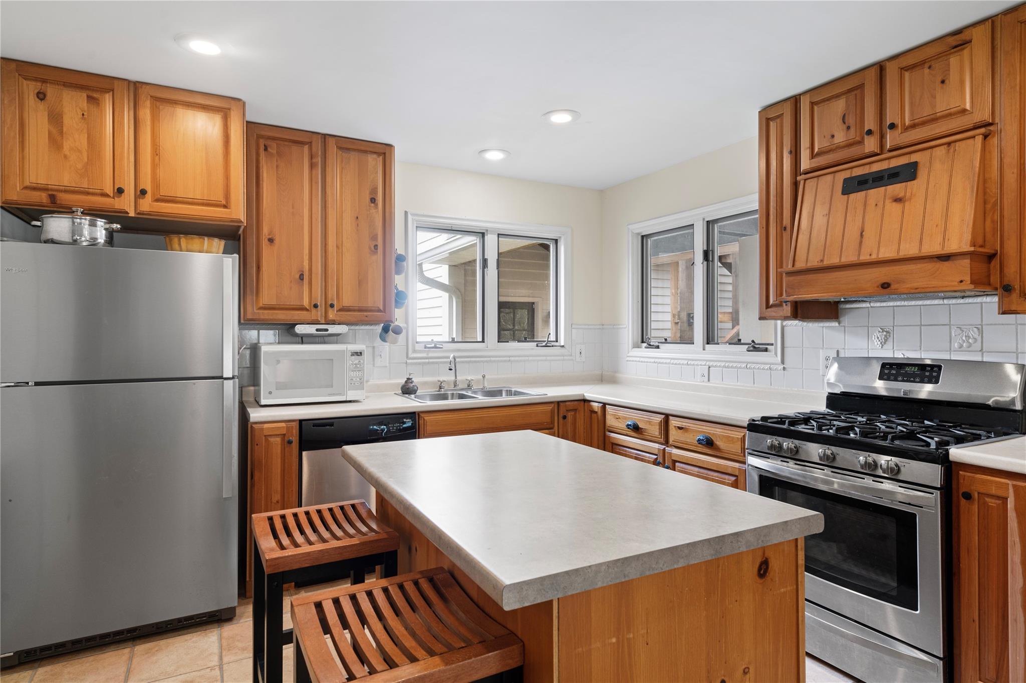6627 Smith Road Stanfield, NC 28163 - Photo 15 of 40 a kitchen with granite countertop a sink stove and refrigerator