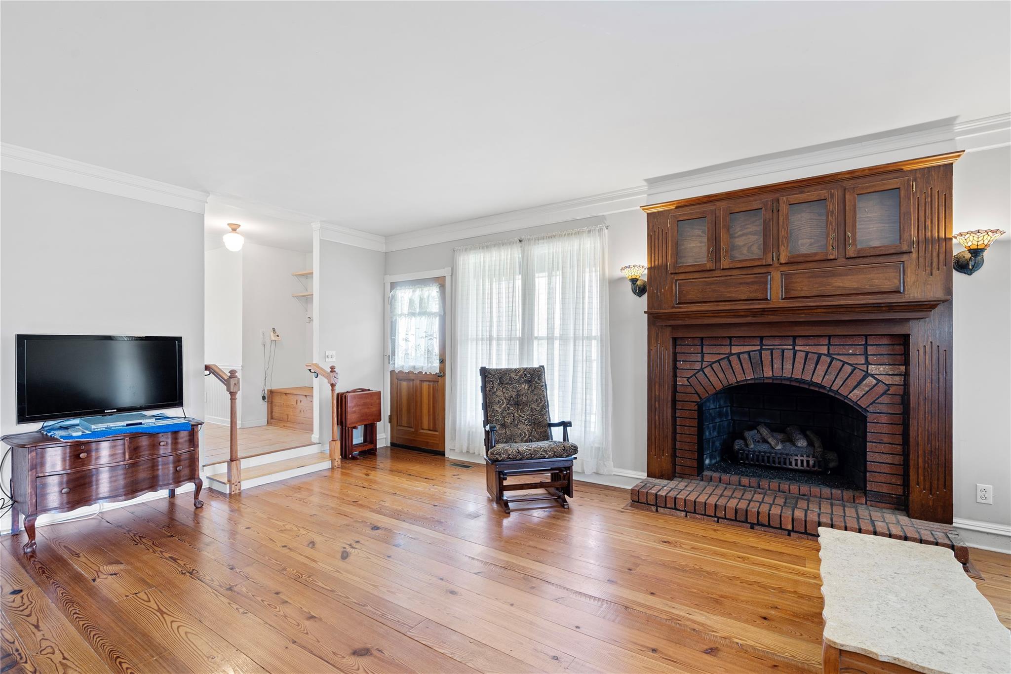 6627 Smith Road Stanfield, NC 28163 - Photo 3 of 40 a living room with furniture and a fireplace or television
