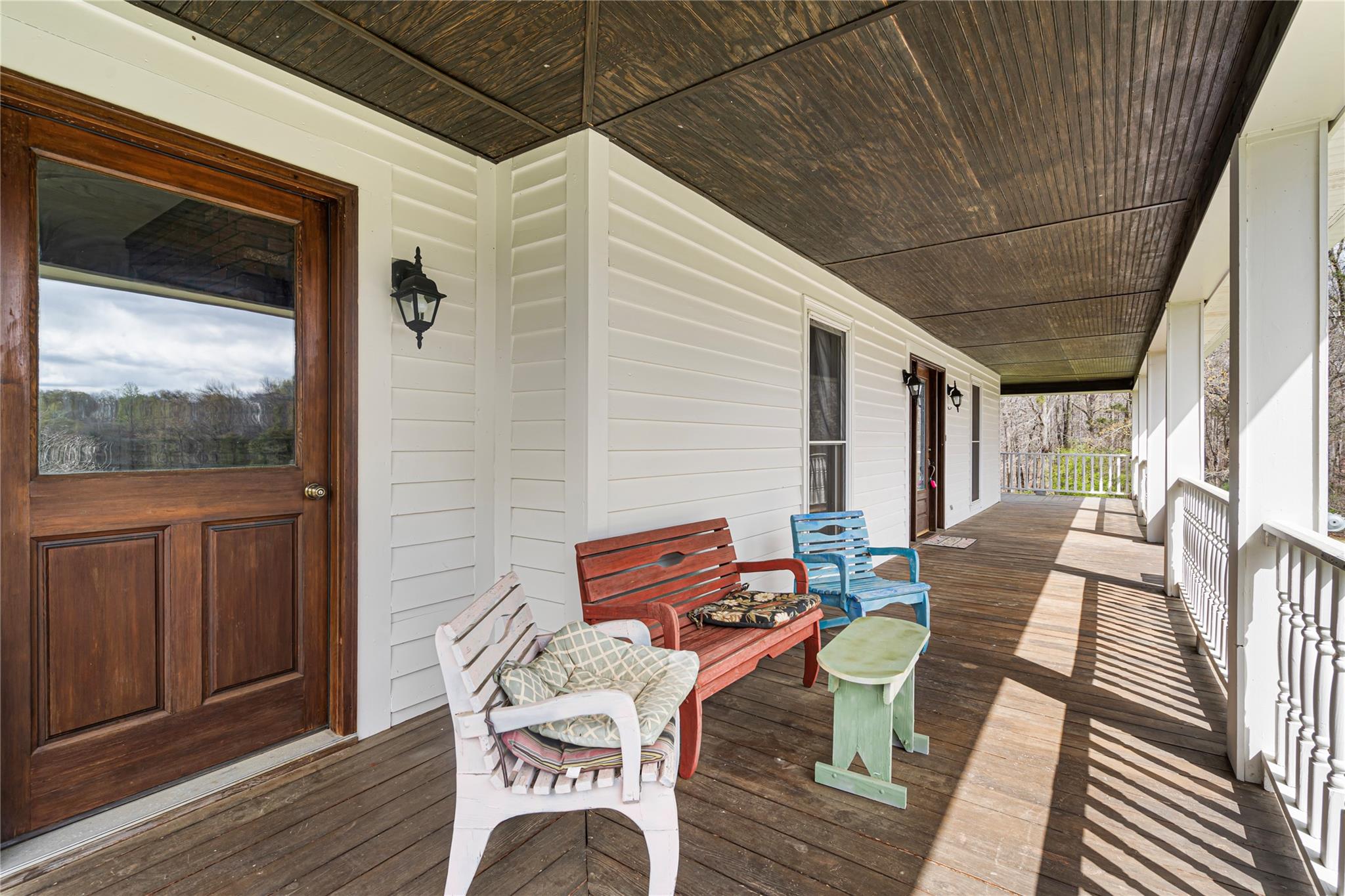6627 Smith Road Stanfield, NC 28163 - Photo 31 of 40 a outdoor space with patio the couches and a dining table and chairs with wooden floor