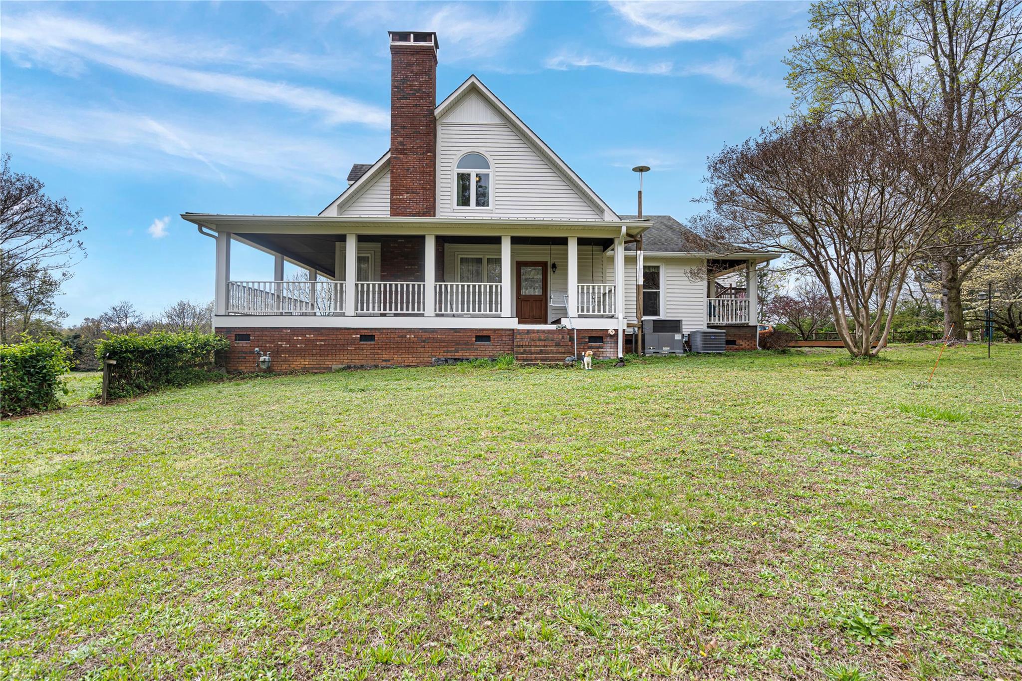 6627 Smith Road Stanfield, NC 28163 - Photo 33 of 40 a front view of a house with a garden and trees