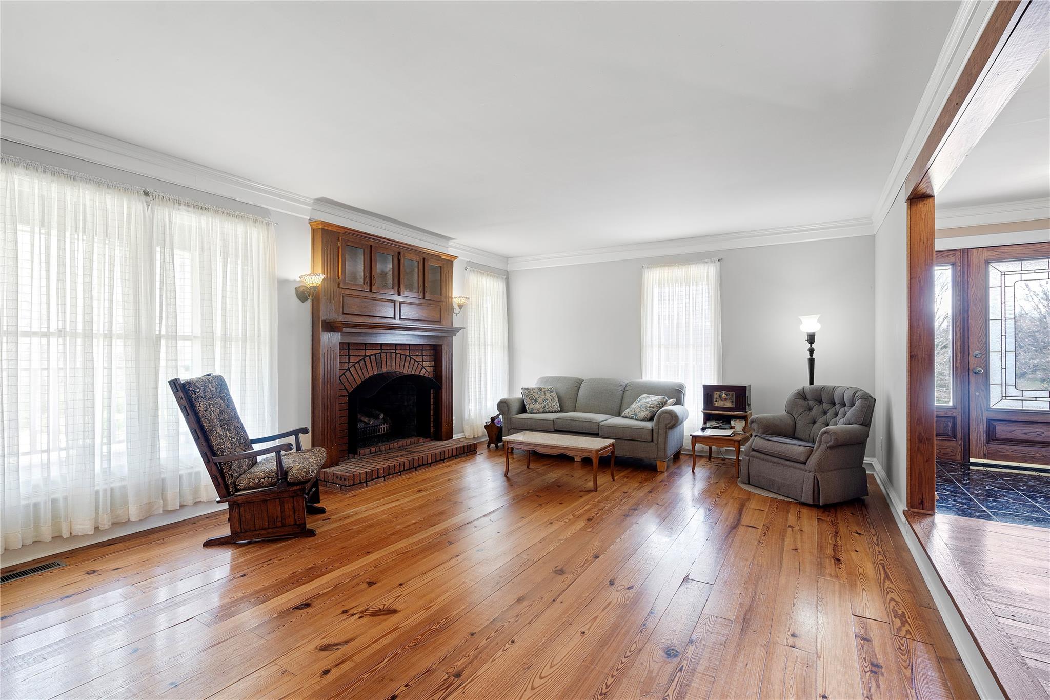 6627 Smith Road Stanfield, NC 28163 - Photo 4 of 40 a living room with furniture and a fireplace