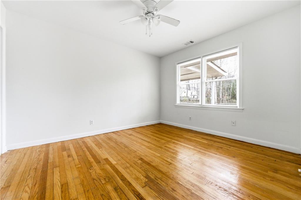 45 Chaffin Road Roswell, GA 30075 - Photo 18 of 26 a view of empty room with wooden floor and fan