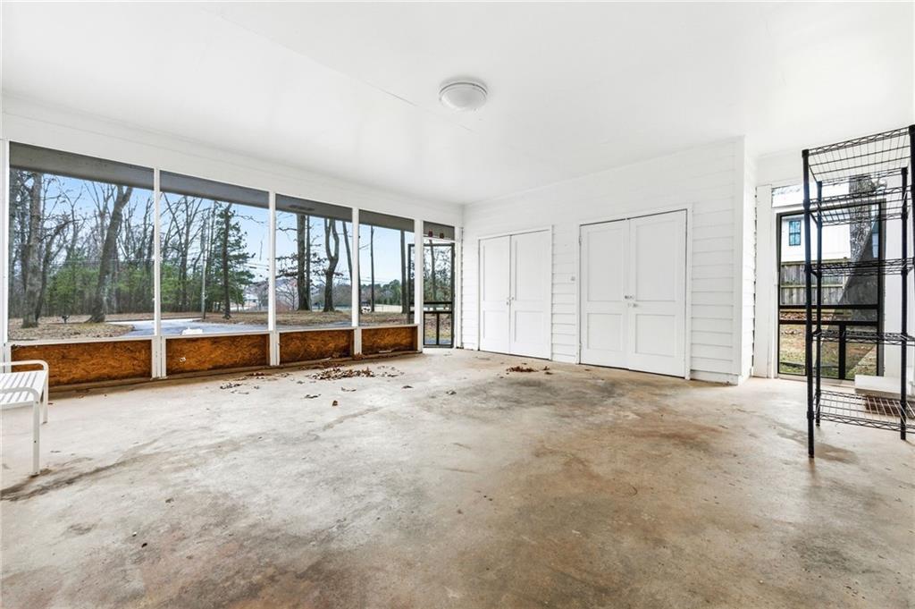 45 Chaffin Road Roswell, GA 30075 - Photo 22 of 26 an empty room with sliding glass door and floor to ceiling window