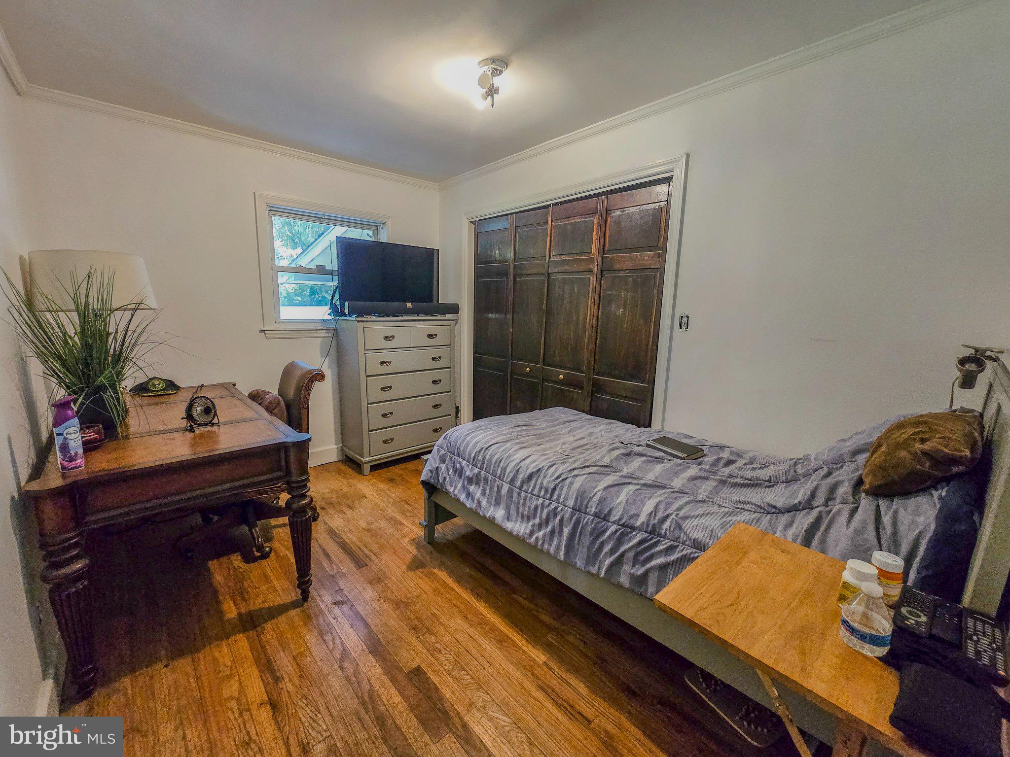33 Delwood Road Cherry Hill, NJ 08002 - Photo 14 of 27 Cozy bedroom with warm wooden accents.