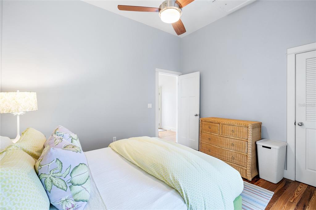 340 Palm Avenue Boca Grande, FL 33921 - Photo 19 of 38 a bedroom with a bed and wooden floor