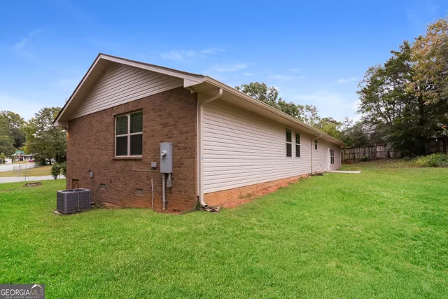 a backyard of a house with lots of green space