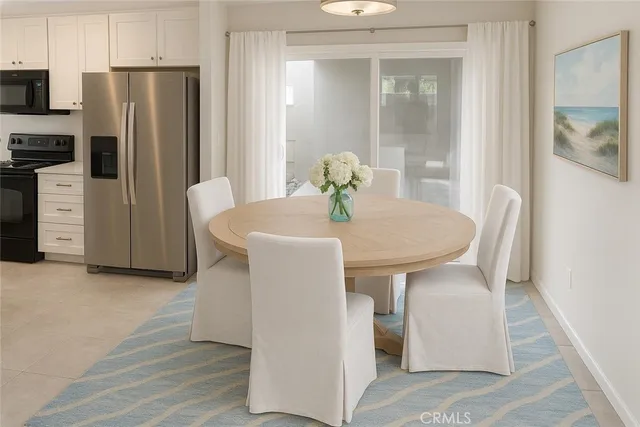 a kitchen with stainless steel appliances granite countertop a refrigerator a sink a stove with wooden floor and cabinets