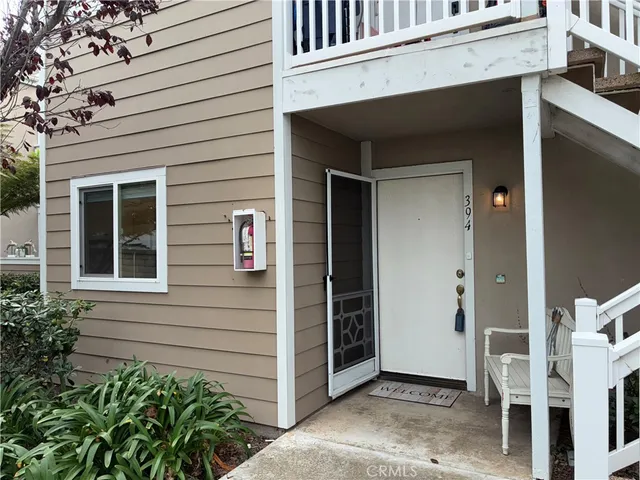 a view of front door and potted plants