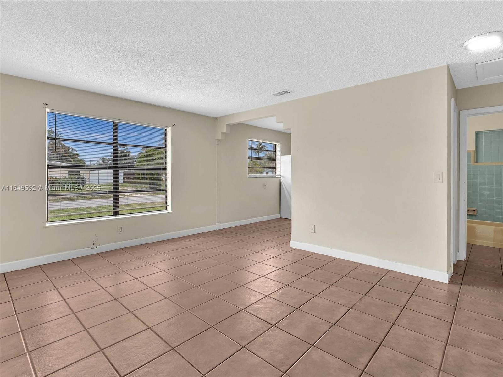 5611 Southwest 37th Street, Unit 1 Davie, FL 33314 - Photo 14 of 46 a view of an empty room with window