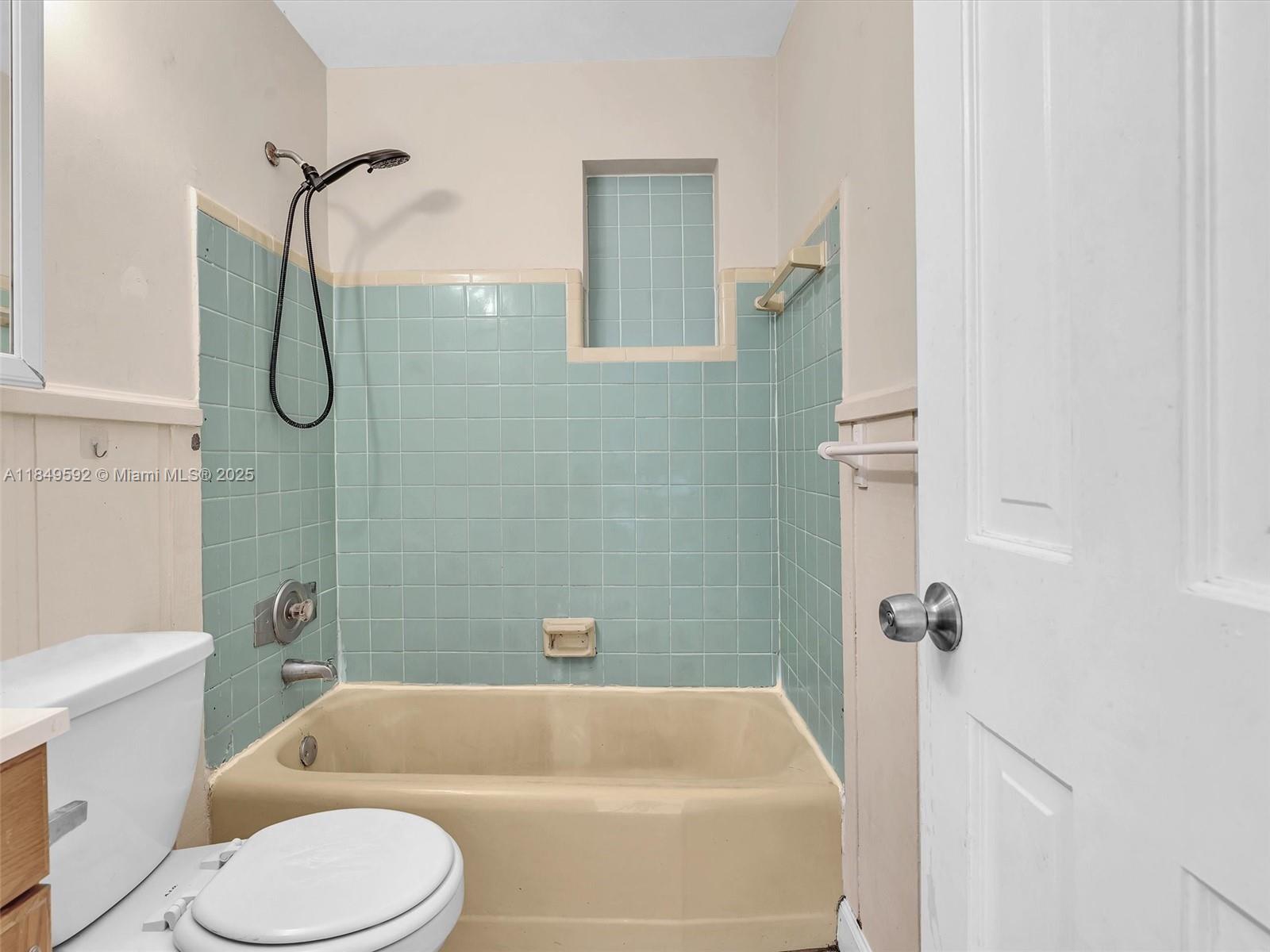 5611 Southwest 37th Street, Unit 1 Davie, FL 33314 - Photo 20 of 46 a bathroom with a toilet bathtub and shower