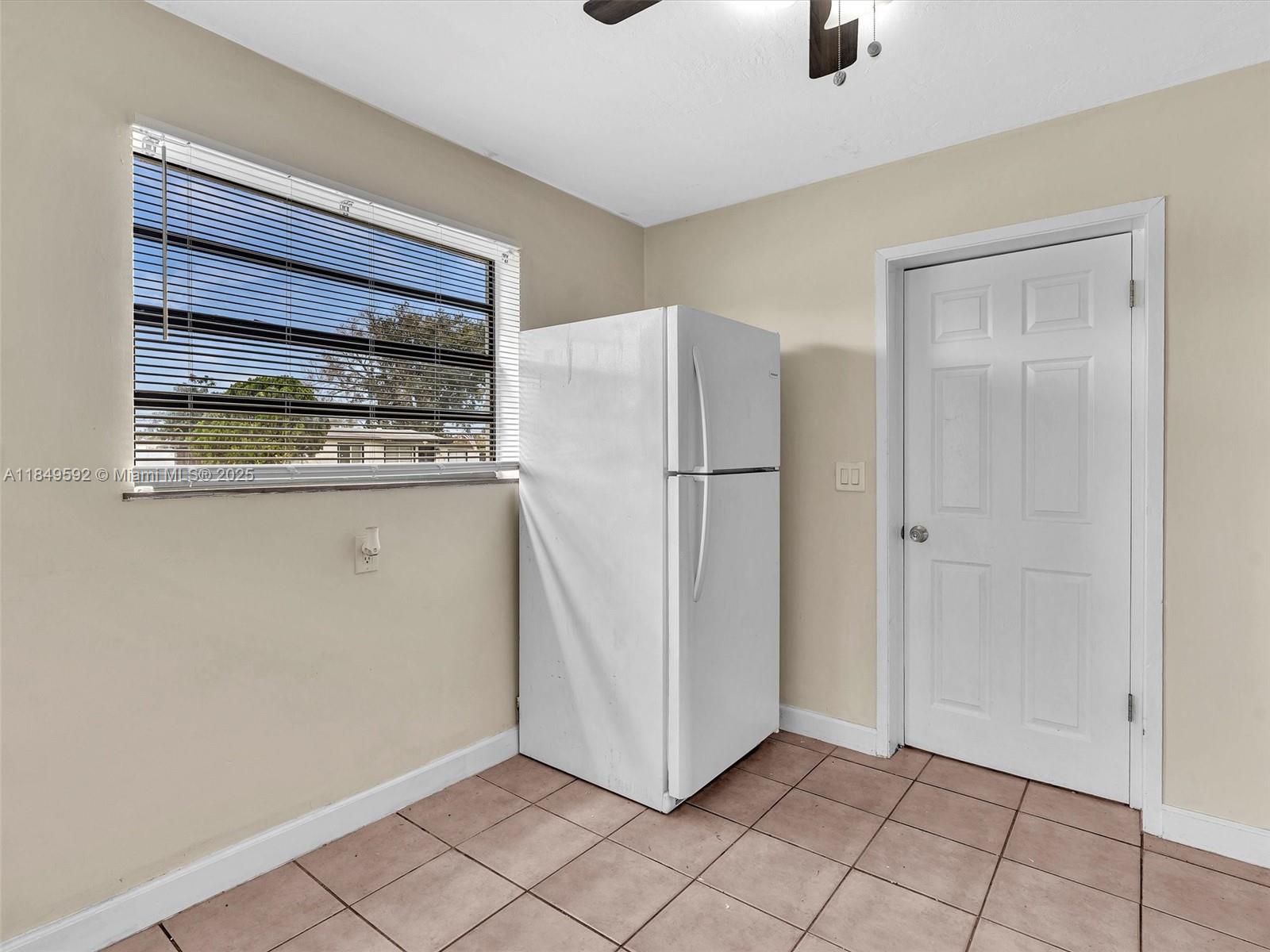 5611 Southwest 37th Street, Unit 1 Davie, FL 33314 - Photo 26 of 46 a view of cabinets and entryway