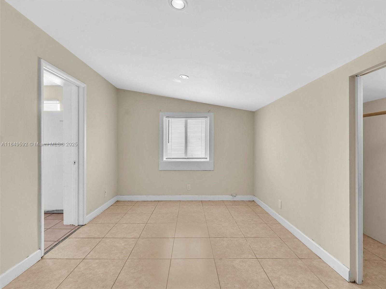 5611 Southwest 37th Street, Unit 1 Davie, FL 33314 - Photo 29 of 46 a view of an empty room with a window