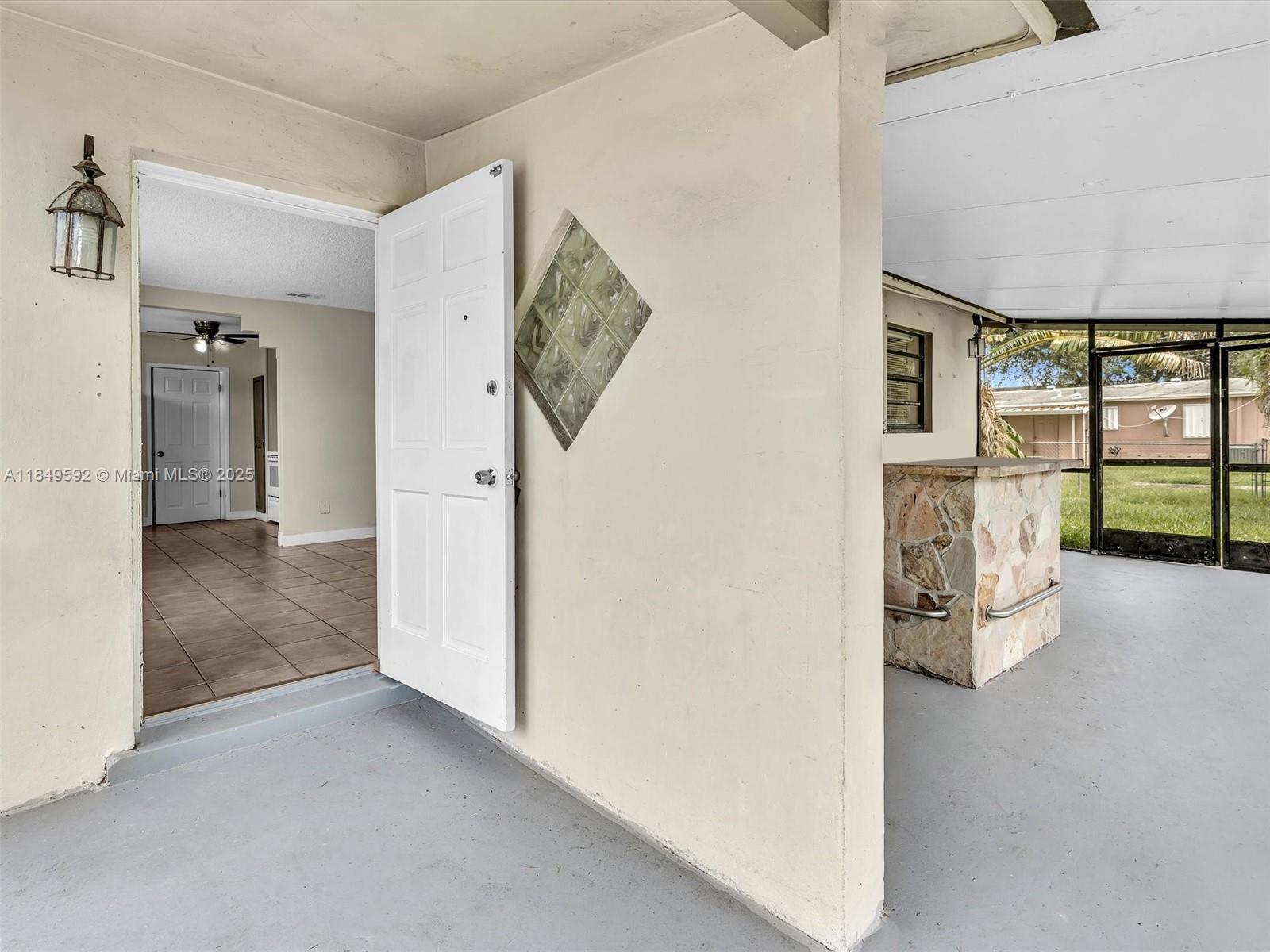 5611 Southwest 37th Street, Unit 1 Davie, FL 33314 - Photo 3 of 46 an entryway at an empty room
