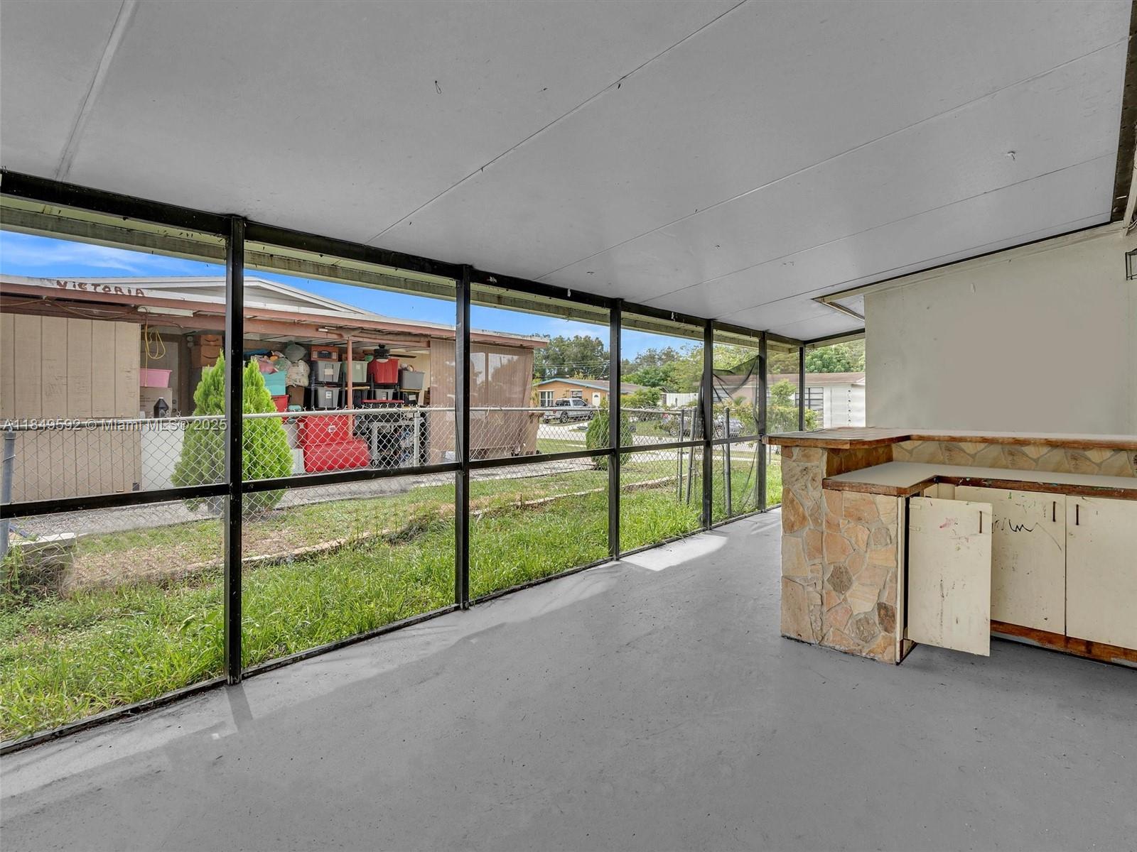 5611 Southwest 37th Street, Unit 1 Davie, FL 33314 - Photo 34 of 46 a view of an empty room with a sliding door