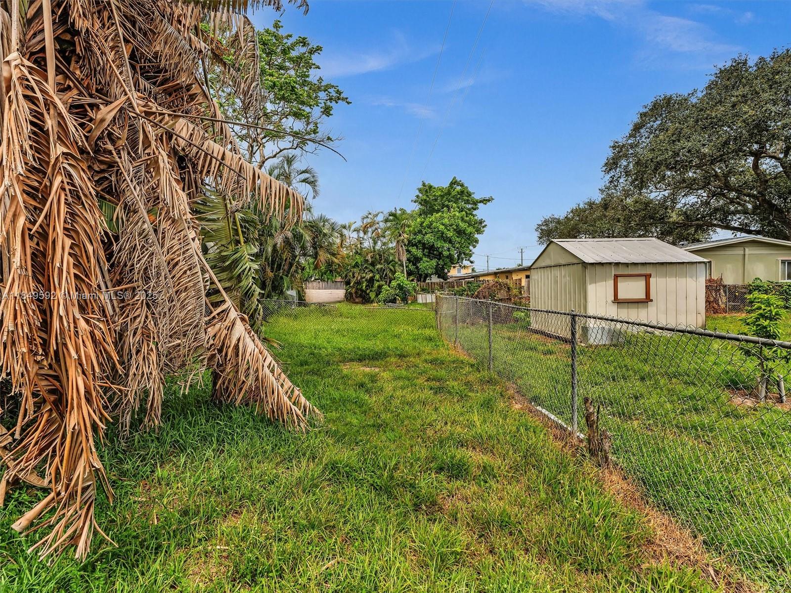 5611 Southwest 37th Street, Unit 1 Davie, FL 33314 - Photo 37 of 46 a view of a house with a yard