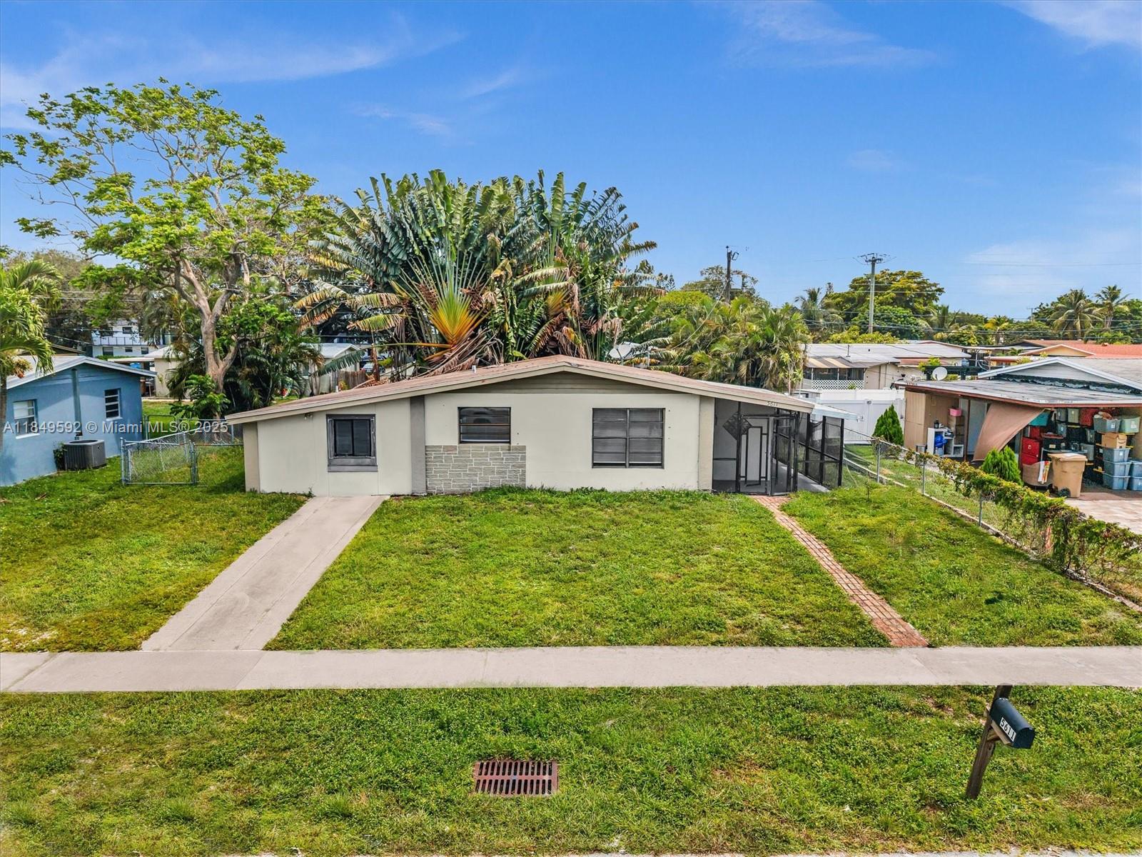 5611 Southwest 37th Street, Unit 1 Davie, FL 33314 - Photo 40 of 46 a view of a yard in front of house