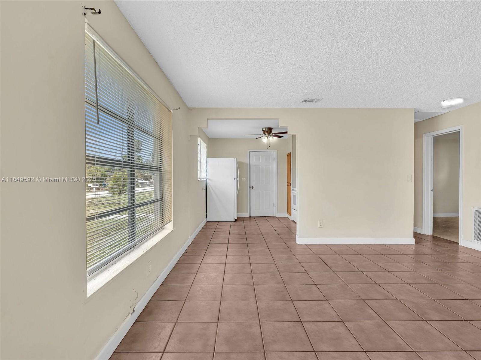 5611 Southwest 37th Street, Unit 1 Davie, FL 33314 - Photo 4 of 46 a view of a room with an empty space and a window