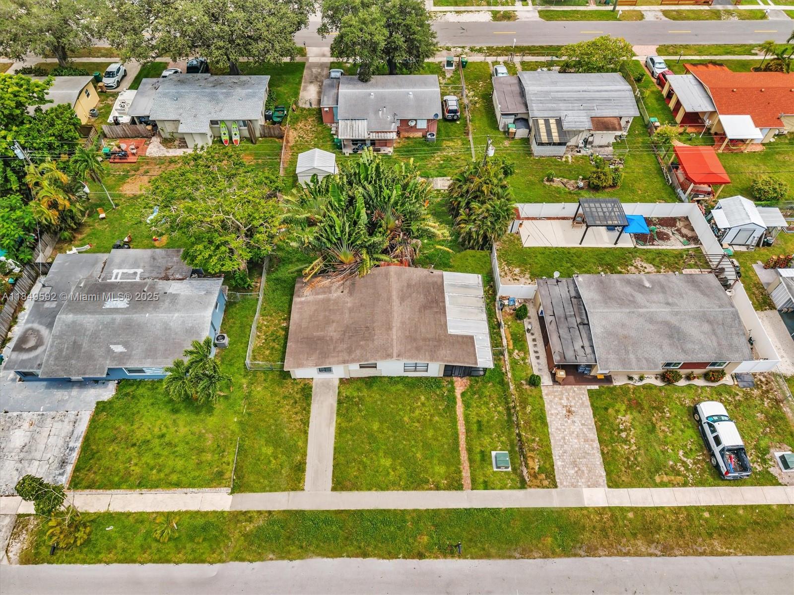 5611 Southwest 37th Street, Unit 1 Davie, FL 33314 - Photo 45 of 46 an aerial view of residential houses with outdoor space and street view