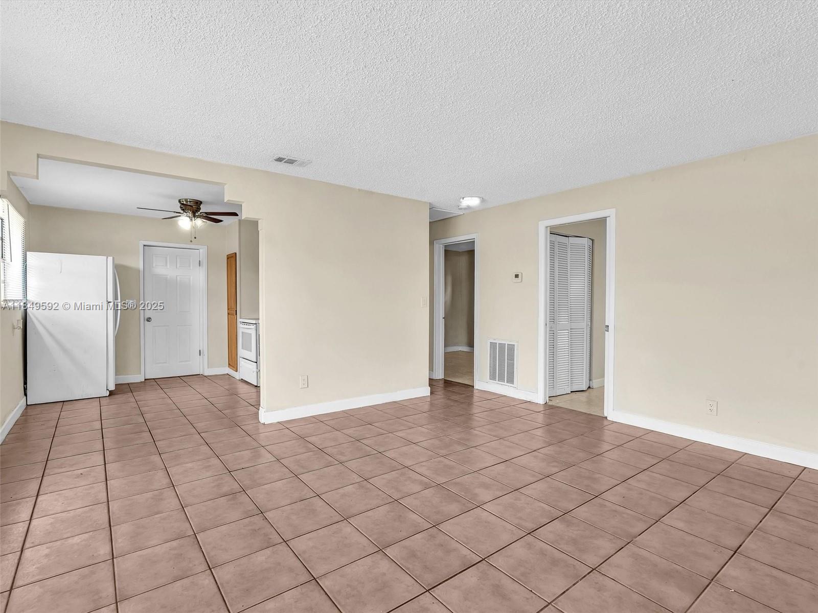 5611 Southwest 37th Street, Unit 1 Davie, FL 33314 - Photo 5 of 46 a view of a livingroom with an empty space