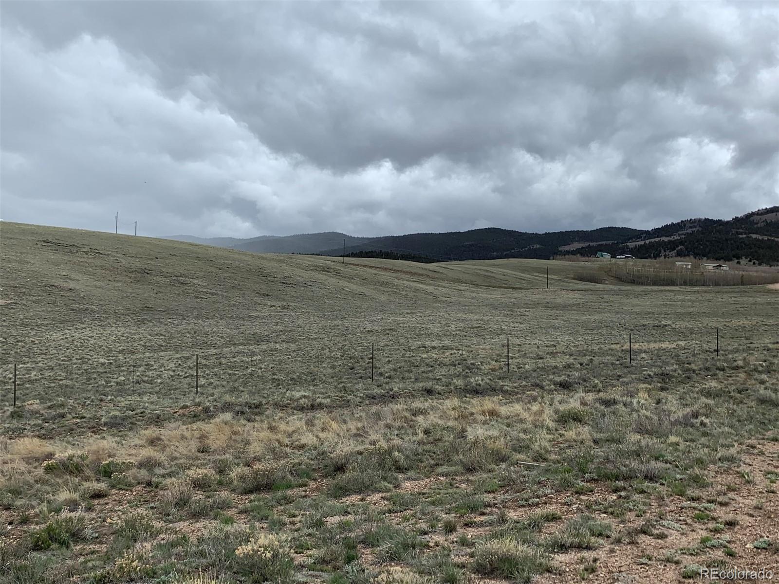 5739 Ranch Road Hartsel, CO 80449 - Photo 3 of 21 a view of a lake and mountain in the back
