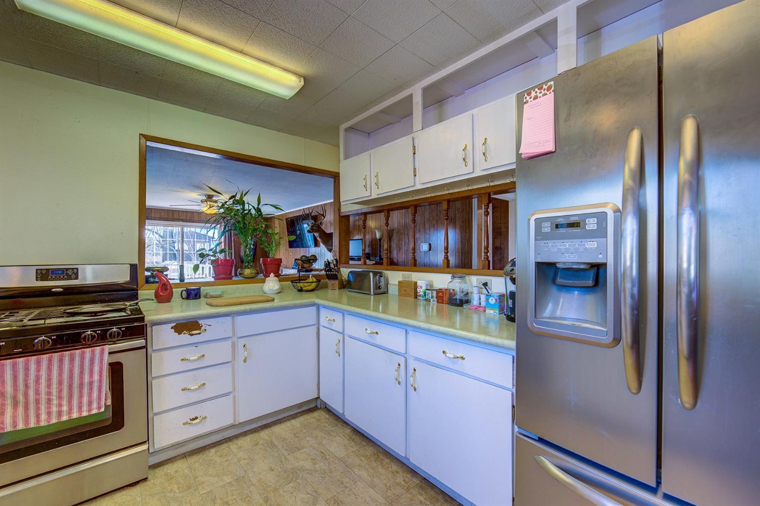4149 Hilsinger Road Phoenix, OR 97535 - Photo 9 of 35 a kitchen with stainless steel appliances granite countertop a refrigerator and a stove