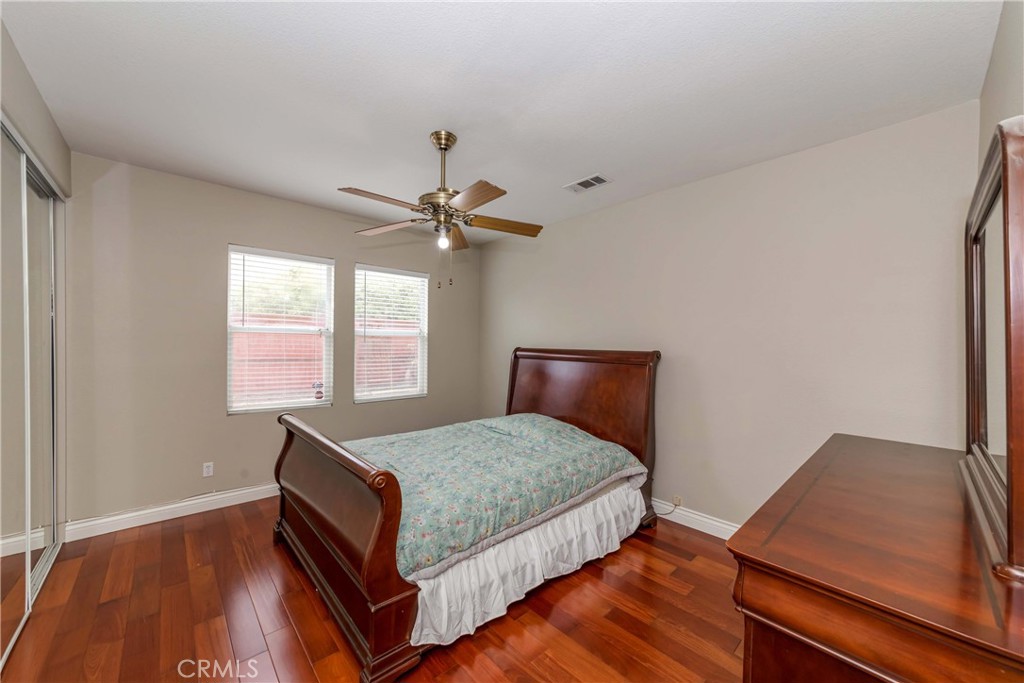 9220 Village Way Riverside, CA 92508 - Photo 15 of 73 a bedroom with a bed and window