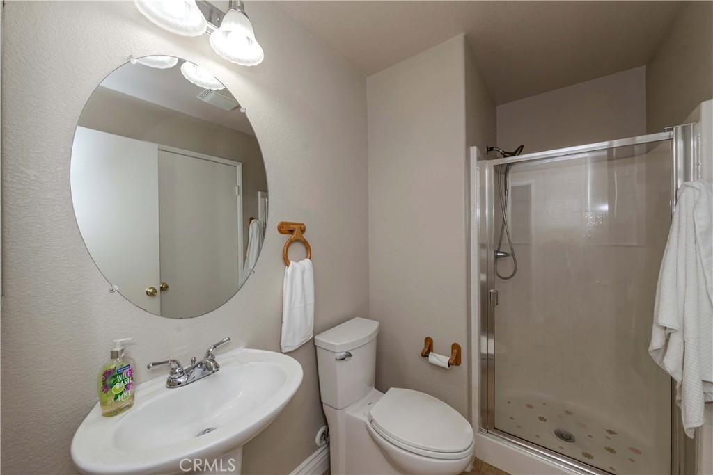 9220 Village Way Riverside, CA 92508 - Photo 16 of 73 a bathroom with a sink toilet and shower