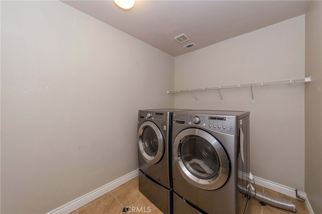 9220 Village Way Riverside, CA 92508 - Photo 19 of 73 a utility room with dryer and washer