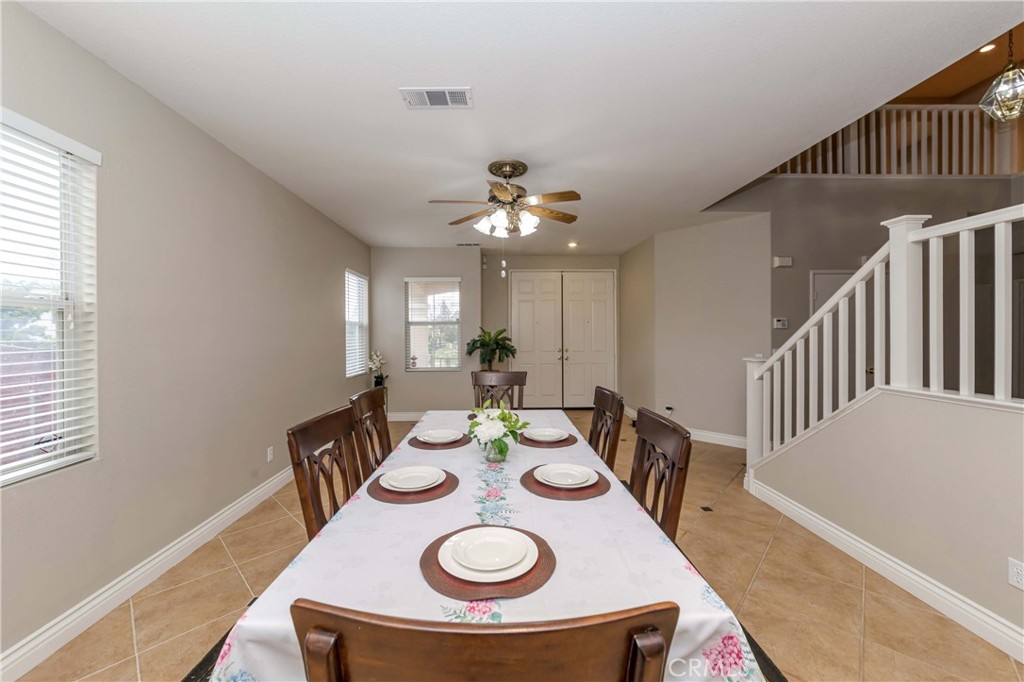 9220 Village Way Riverside, CA 92508 - Photo 26 of 73 a view of a dining room with furniture and a chandelier