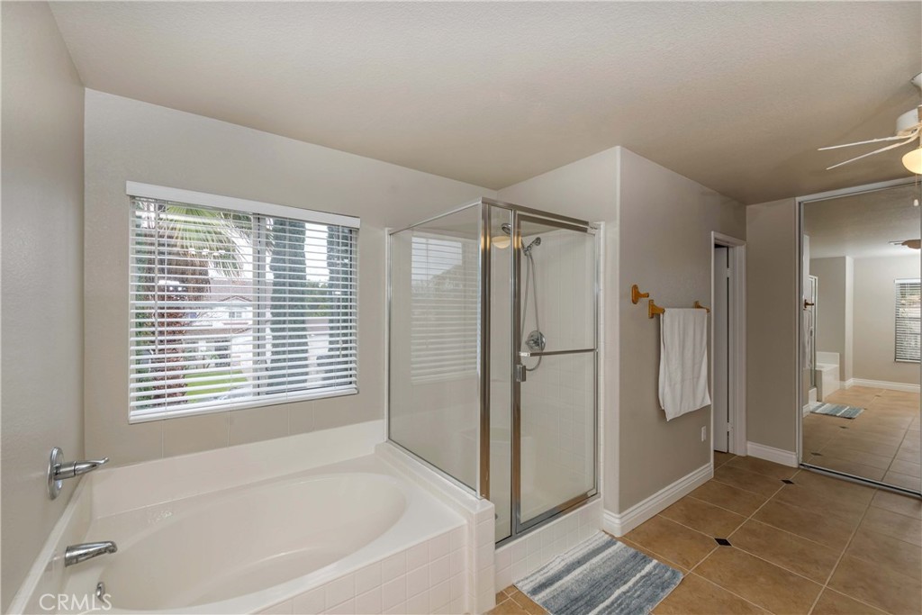 9220 Village Way Riverside, CA 92508 - Photo 30 of 73 a bathroom with a bathtub and a shower
