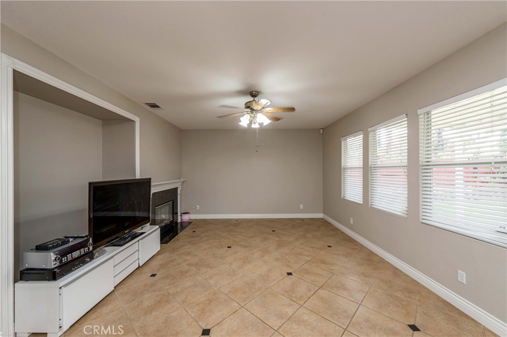 9220 Village Way Riverside, CA 92508 - Photo 3 of 73 a living room with a flat screen tv and a window