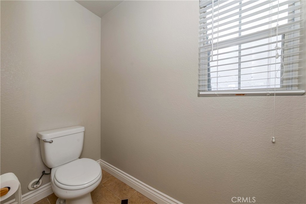 9220 Village Way Riverside, CA 92508 - Photo 32 of 73 a white toilet sitting next to a window